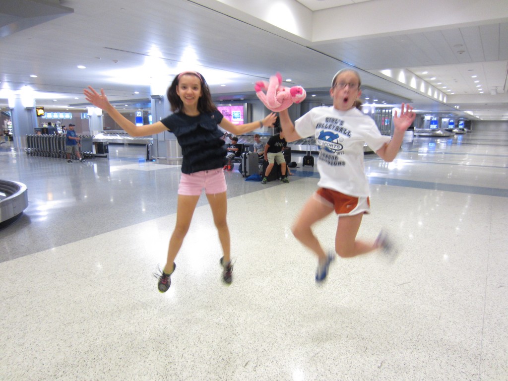 Grace and Julia have fun at the airport.