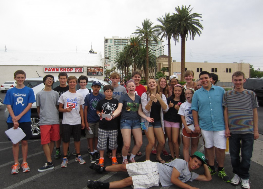 Most of the group poses for a picture at 'Pawn Wars' shop.