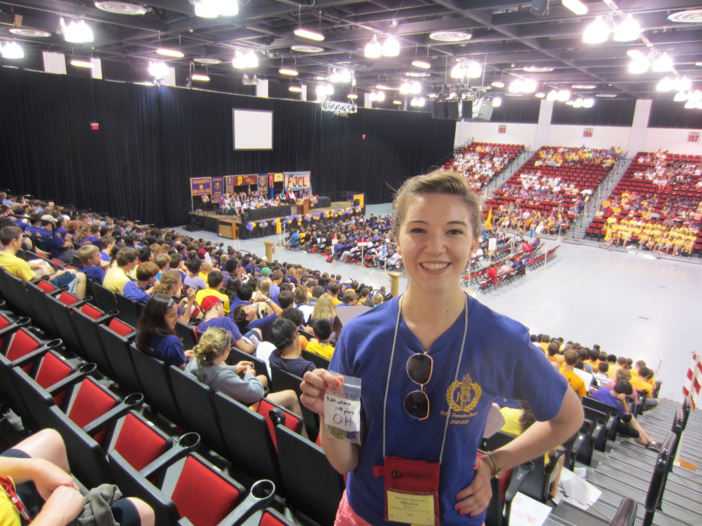 Regina and her award, from the back row of the auditorium, with nice view of the delegates and stage,